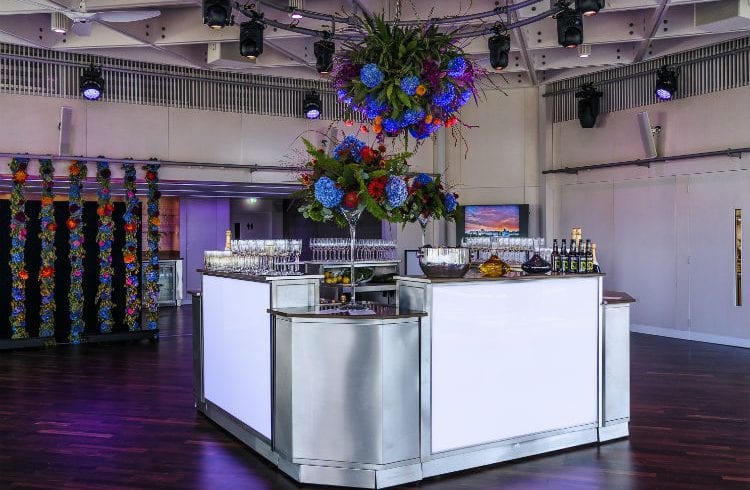 The Buffini Chao Deck event hire space - bar with flowers