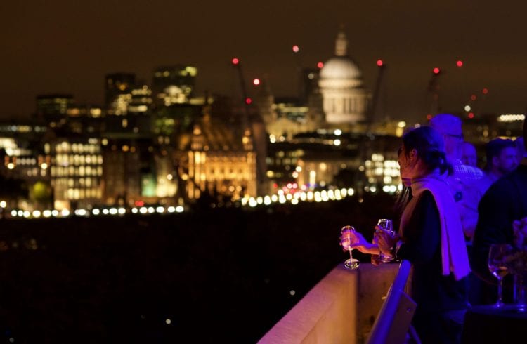 The Buffini Chao Deck event hire space exterior at night looking east to St Paul's