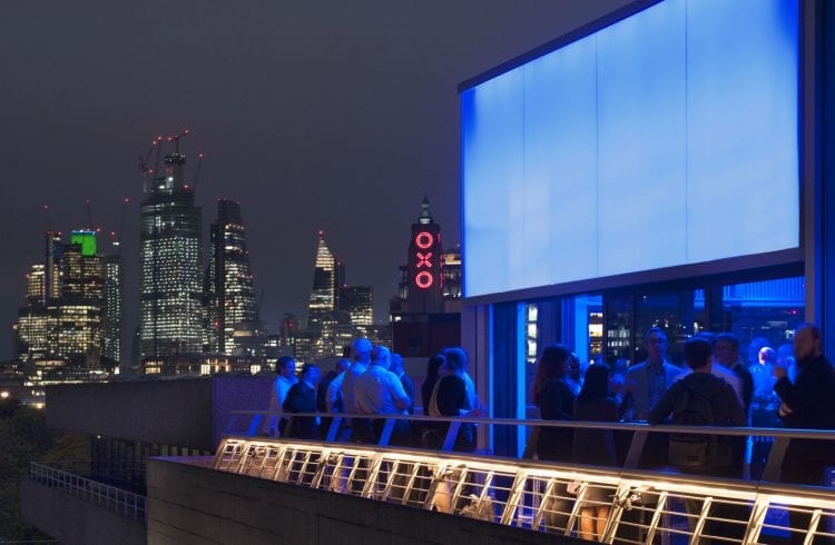The Buffini Chao Deck event hire space - terrace exterior at night, looking east to the City