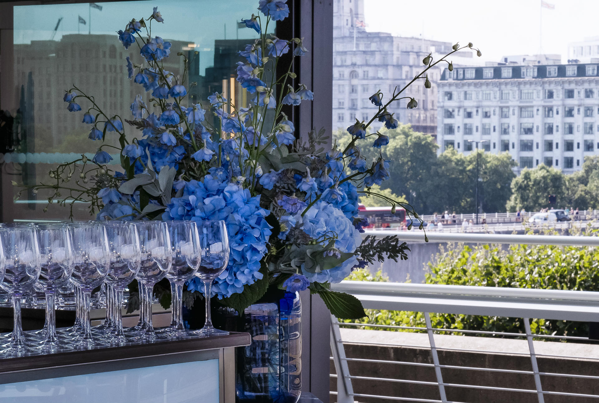 The Buffini Chao Deck event hire space view from interior with flowers towards the north bank of the Thames