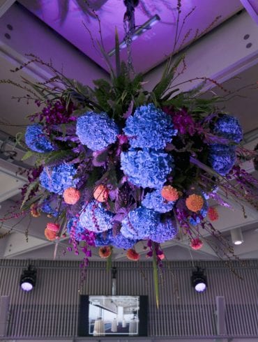 The Buffini Chao Deck event hire space: with flower arrangement suspended from ceiling