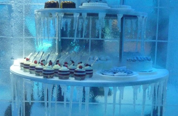 Desserts on a tiered stand in a Christmas 'Ice' theme with icicles