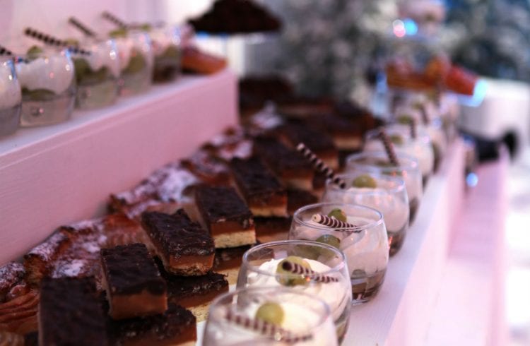 Desserts displayed on tiered shelves
