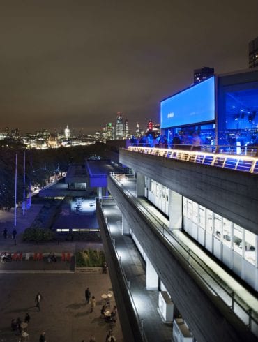 The Buffini Chao Deck event hire space: the terrace with people and views towards the city