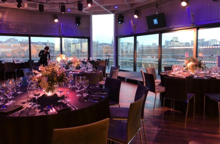 Tables being prepared and checked for a dinner