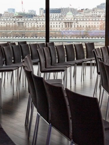 The Buffini Chao Deck event hire space: conference setup with seating and view of Somerset House