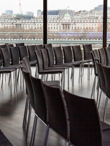 The Buffini Chao Deck event hire space: conference setup with seating and view of Somerset House