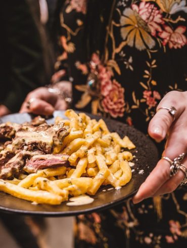A plate of beef and fries