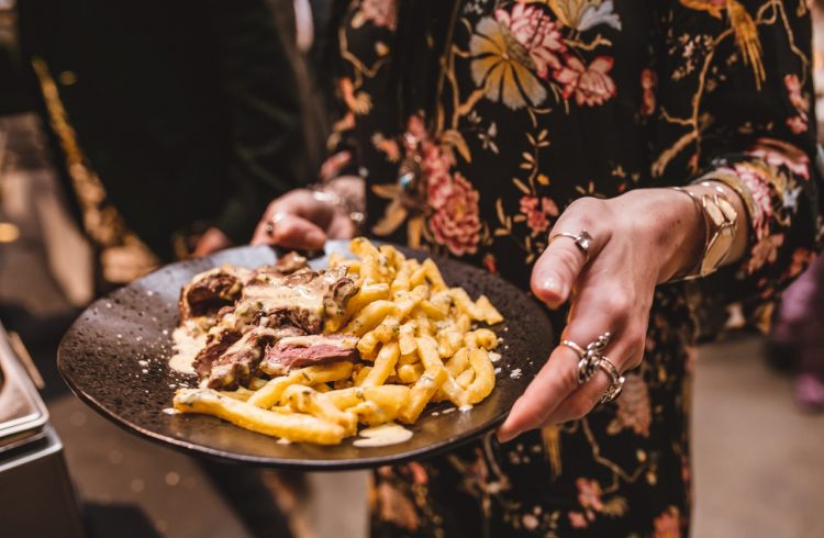 A plate of beef and fries