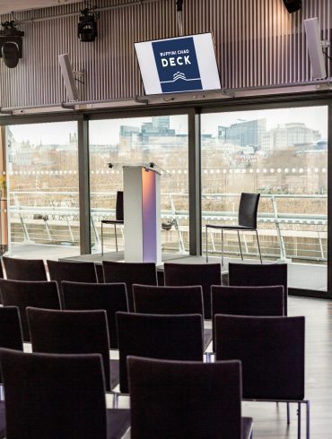 The Buffini Chao Deck: Conference setup with lectern and chairs