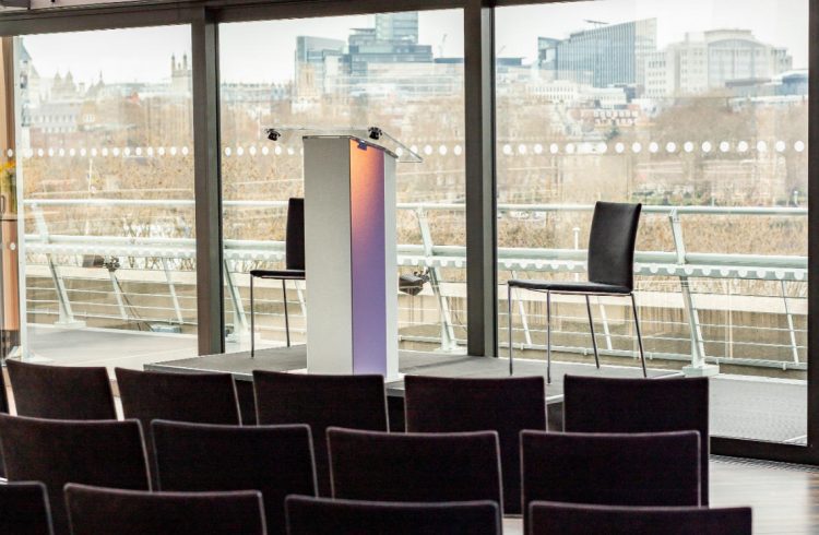 The Buffini Chao Deck: Conference setup with lectern and chairs