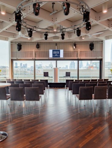 The Buffini Chao Deck: Conference setup with lectern chairs and high tables