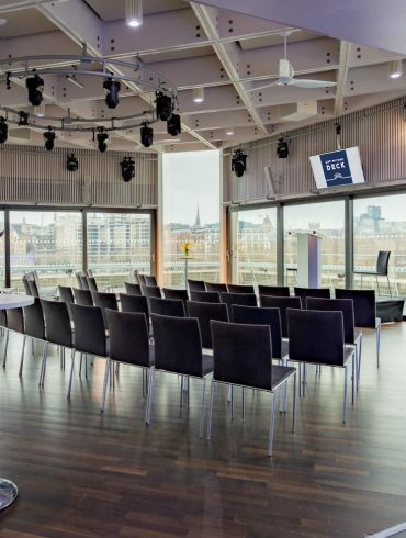 The Buffini Chao Deck: Conference setup with lectern chairs and high tables