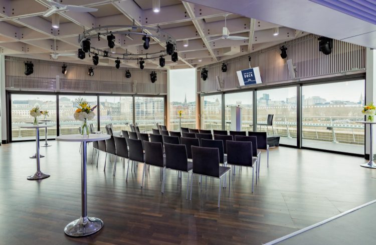 The Buffini Chao Deck: Conference setup with lectern chairs and high tables