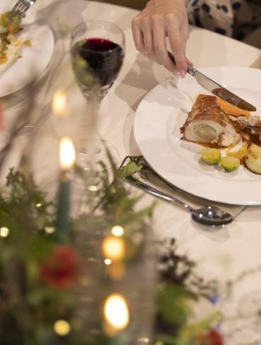 People sat eating for dinner