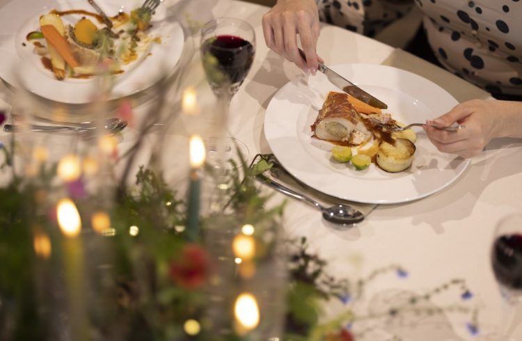 People sat eating for dinner